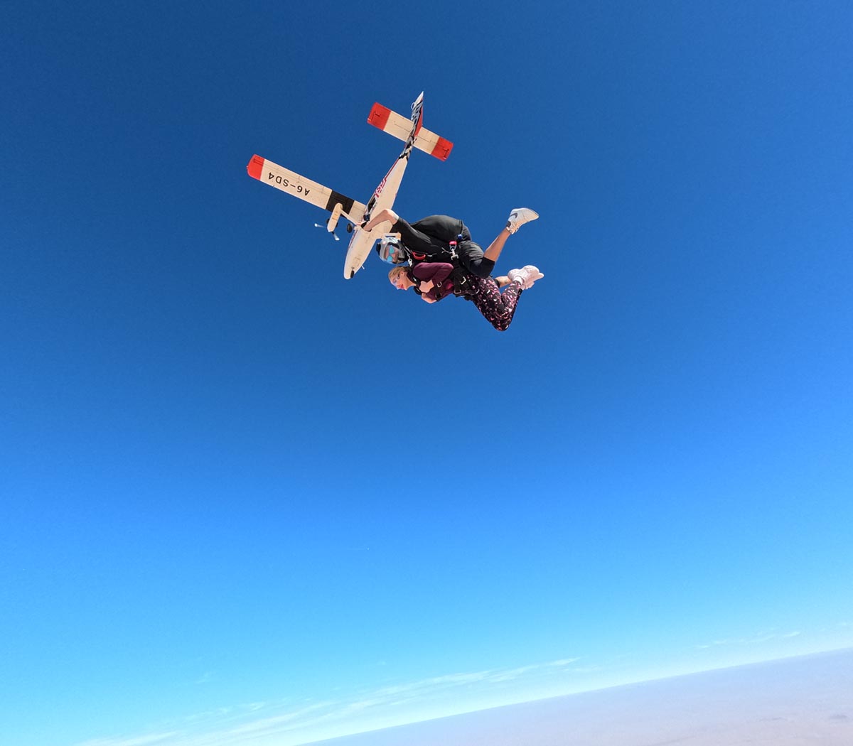 Skydiving from a small aircraft.